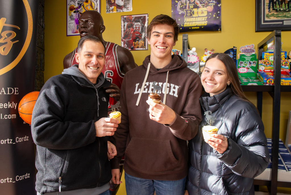 Guest enjoying cupcakes and cookies at the grand opening