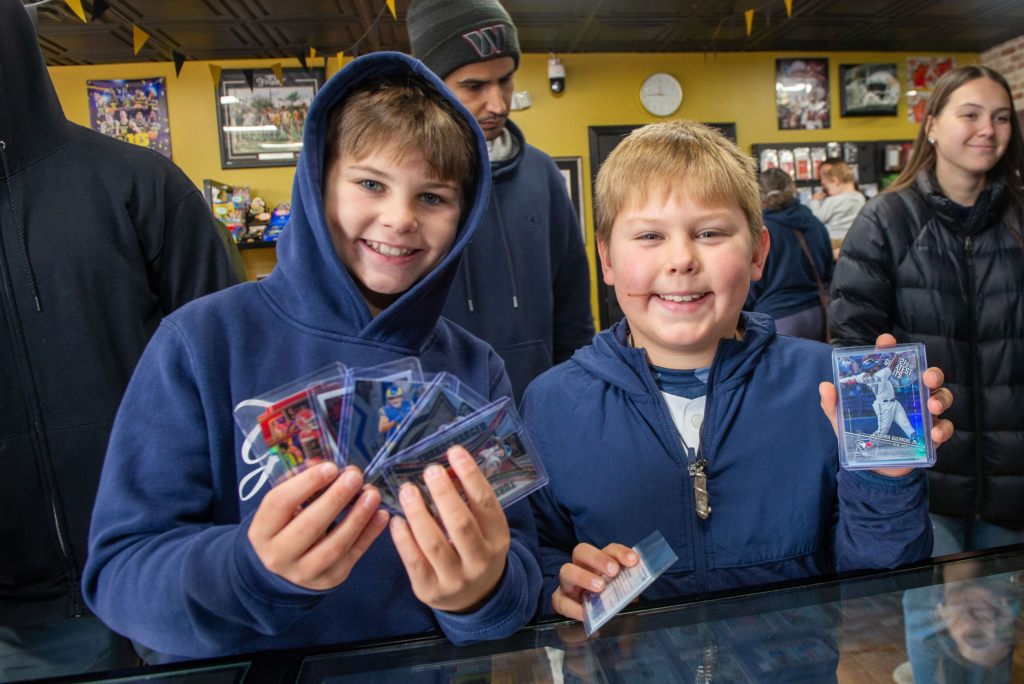 Happy customers showing off their new cards