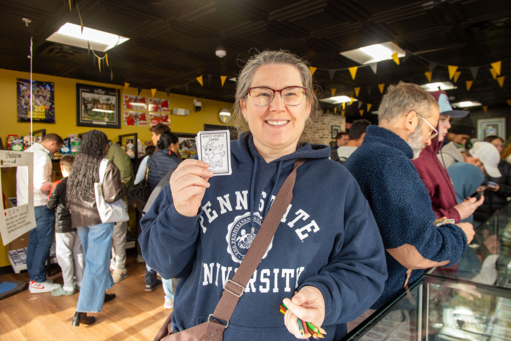 Kids and adults enjoying the color-your-own trading card