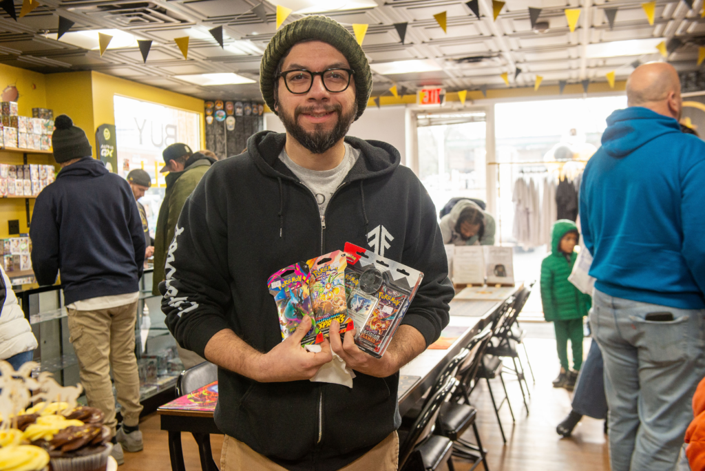 A satisfied customer with his new Pokemon packs