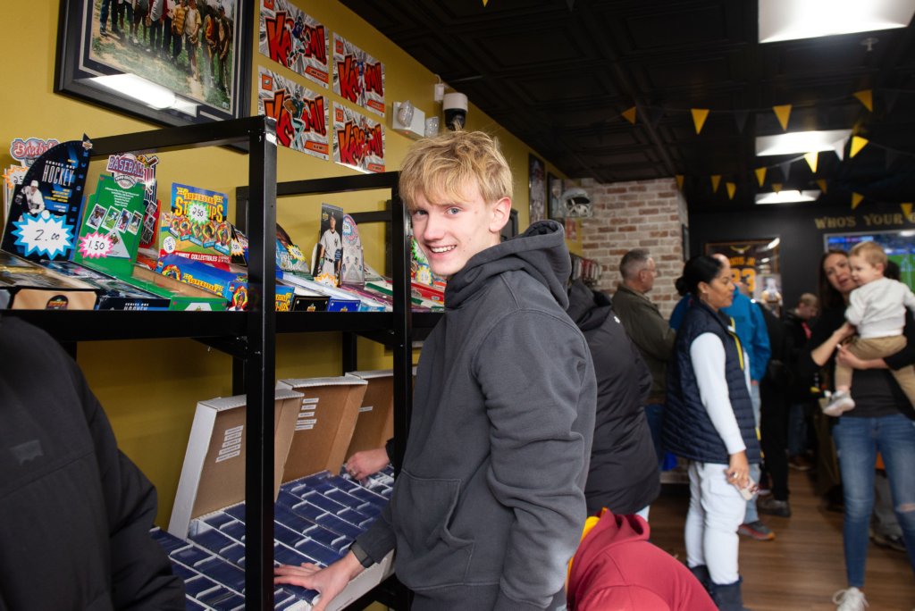 A customer looking through the dollar bin shelves