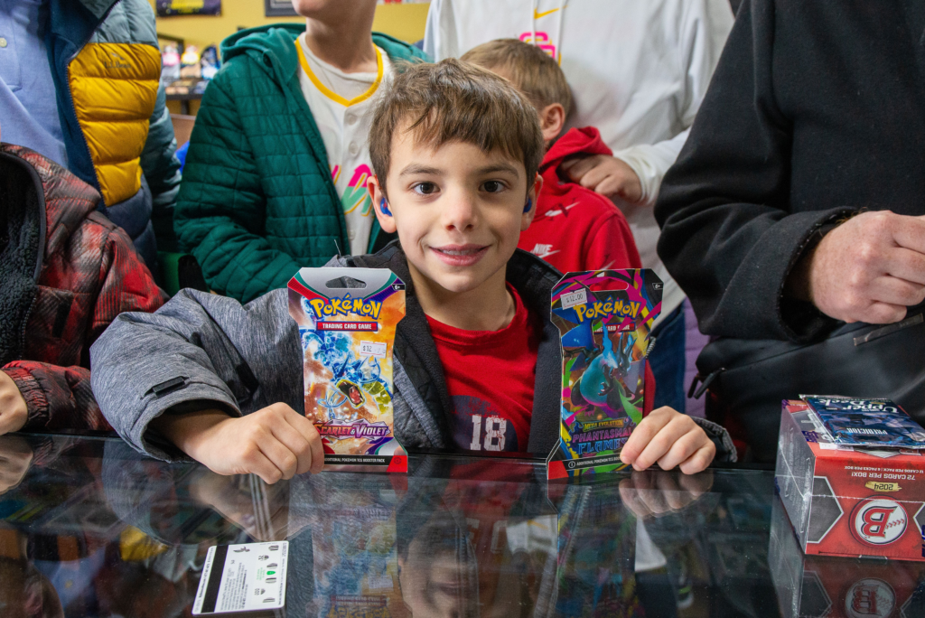 One of our younger collectors showing off his Pokemon pack