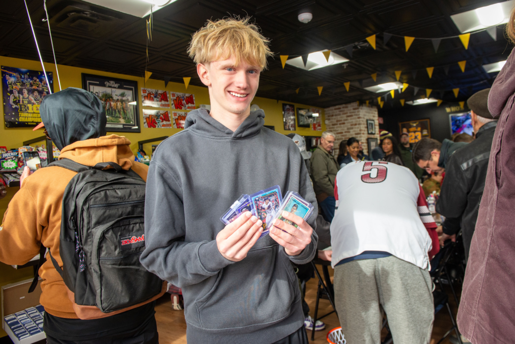 A younger collector showing of his great finds