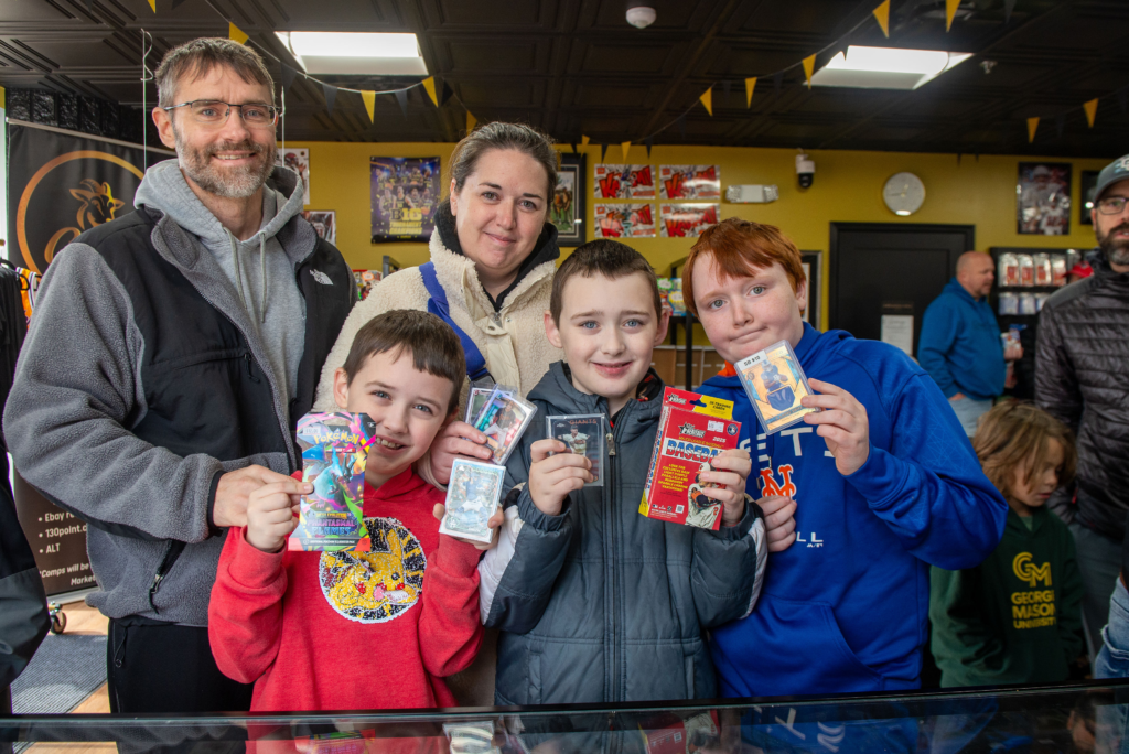 One family shows off their purchases from the grand opening event