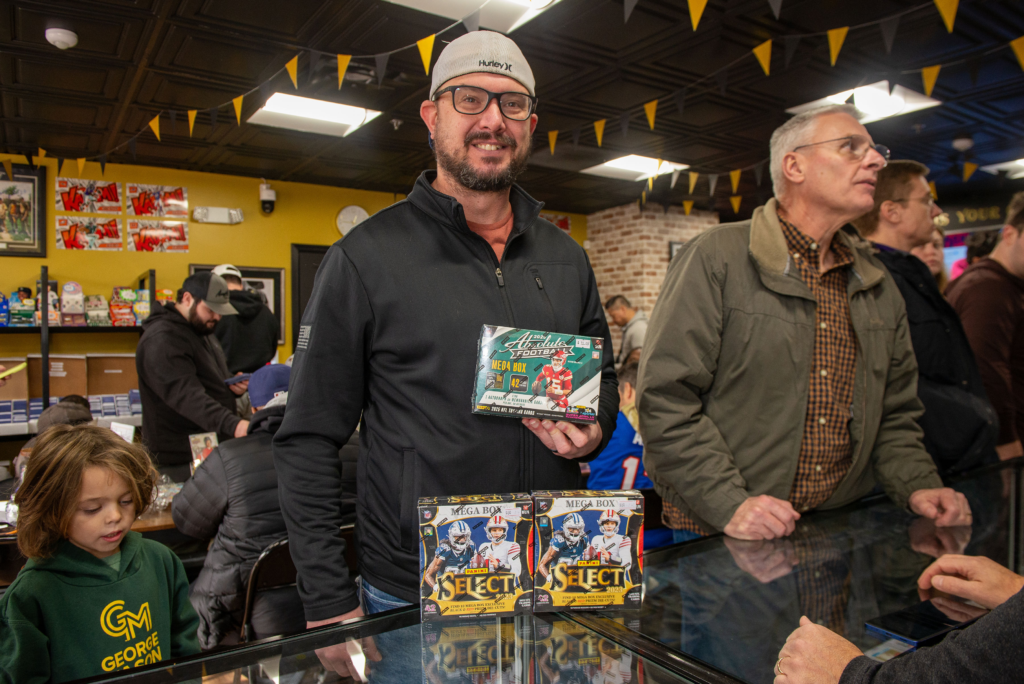 One customer showing off his football purchases