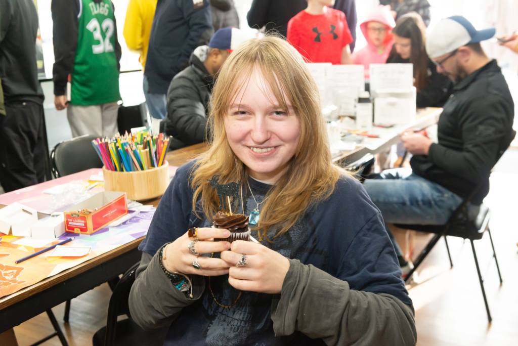 One customer enjoying the complementary cupcakes