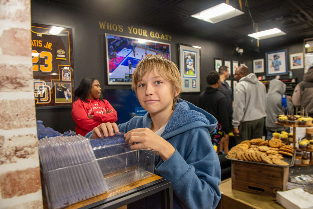 One customer flipping through the Pokemon value bins
