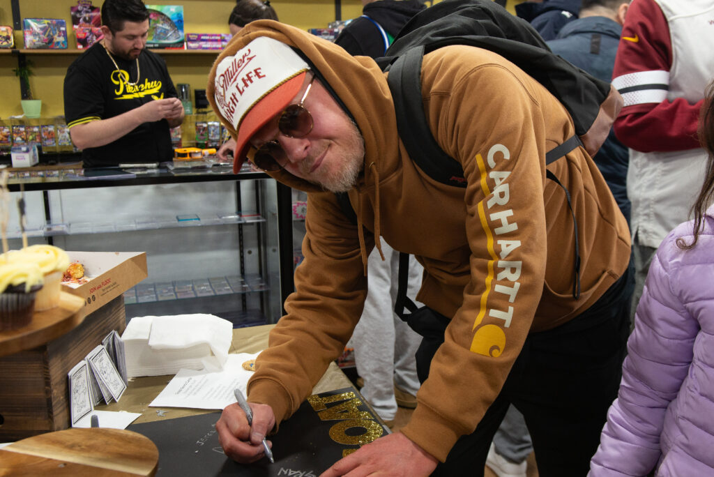 A customer writing down their G.O.A.T. - favorite player