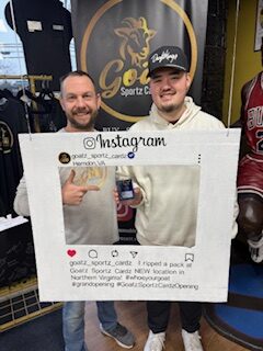 Bryan posing with Elliot's UNREAL pull of the Cooper Flagg – 2025/26 Topps Chrome True Blue Refractor Autograph /150